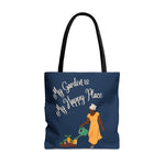 Navy blue tote bag with woman watering a garden and the phrase "My Garden is My Happy Place"