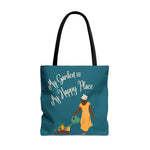 Teal tote bag with woman watering a garden and the phrase "My Garden is My Happy Place"